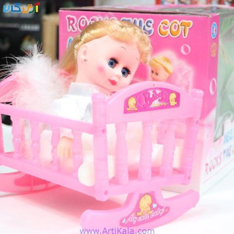 عروسک فرشته ای بر روی تختSWNING ANGEL DOLL