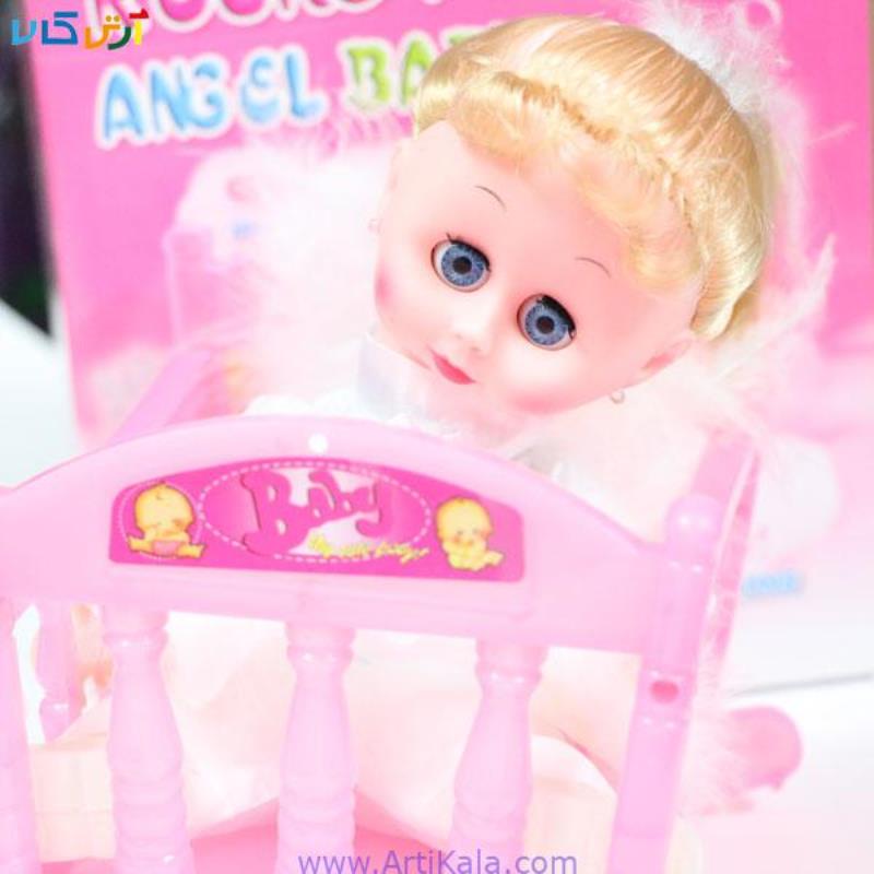 عروسک فرشته ای بر روی تختSWNING ANGEL DOLL